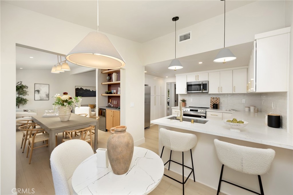Welcome to 45 Oak Tree Lane—an impeccably remodeled townhome located in the highly sought-after Terraces community of Rolling Hills Estates. This spacious 4-bedroom, 3-bath residence offers 2,184 square feet of refined living space, thoughtfully updated with elevated design and luxurious finishes throughout.
Step into the stunning remodeled kitchen featuring sleek quartz countertops, all-new stainless steel appliances, custom cabinetry with soft-close drawers, and stylish matte gold hardware—a space that perfectly blends elegance and functionality.
All bathrooms have been beautifully updated with quartz countertops, modern vanities, designer lighting, statement mirrors, and matte gold fixtures. The expansive primary suite boasts a spa-like en-suite bathroom with an extra-large walk-in shower and generous closet space.
New flooring, fresh interior paint, and energy-efficient LED lighting complete the home’s modern transformation The dining room includes a stylish dry bar perfect for entertaining-while sliding doors lead to private balcony with sweeping city lights ideal for hosting or guests or relaxing. You can also enjoy a patio surrounded by lush landscaping that can be accessed thru sliding doors of primary bedroom and guest bedroom.
A private two-car garage offers added convenience and ample space for storage.
Located within The Terraces—a private, gated community with 24-hour guarded security, five sparkling pools, tennis and pickleball courts, and scenic walking paths. Just minutes from award-winning Palos Verdes schools, beautiful beaches, hiking trails, shopping, and the world-class Terranea Resort.
This is coastal California living at its best—move-in ready and absolutely turnkey.