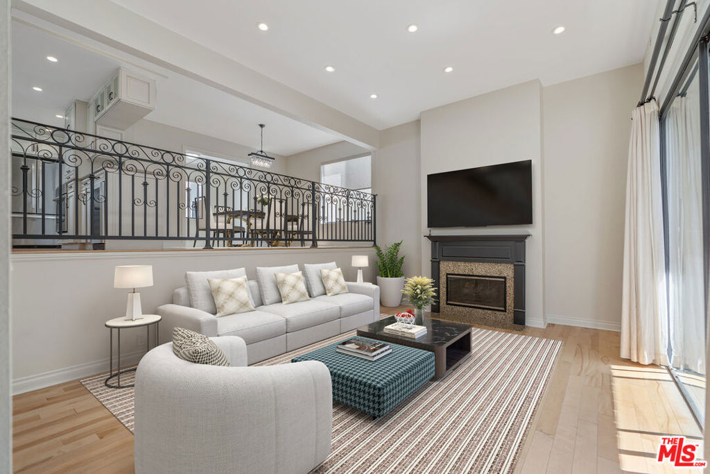 Discover this exceptional Santa Monica townhome in a quiet building just off Montana Avenue, offering rare two-level living with sophisticated design and thoughtful functionality. Enter into the spacious open living area that flows seamlessly through oversized sliding glass doors to a private ground-floor terrace. Unit includes completely redone chef's kitchen featuring slab stone countertops, Bosch appliances, and a five-burner Thermador cooktop. Continue past ample custom built-ins and generous peninsula with wine fridge into the dining space. Also off of the kitchen is a family room/den that can be fully enclosed by true pocket doors. The main level includes a powder room, storage closet, and a striking floating staircase, all anchored by a fireplace with stone hearth and abundant natural light throughout. Upstairs, vaulted ceilings and transom windows elevate the dramatic primary suite, plus and an oversized en-suite bath with wall-to-wall closet space, dual vanities, soaking tub, and separate shower. The second spacious bedroom, full hallway bath, and dedicated laundry area with side-by-side washer/dryer and storage complete the upper level. Additional features include a direct-entry, oversized two-car garage. Positioned perfectly just one block from Montana Avenue's premier shops and restaurants, this central location provides immediate access to PCH, freeways, and the very best of the Westside, all while offering rare tranquility in one of Santa Monica's most peaceful pockets that perfectly balances urban convenience with residential calm.