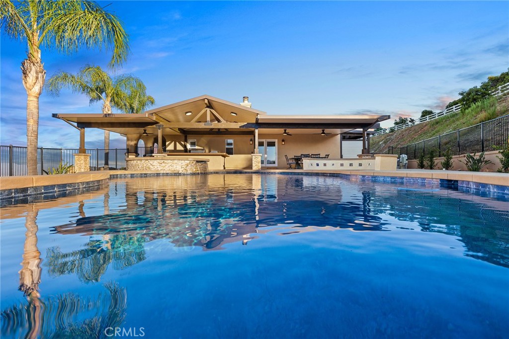 Single story La Cresta home close to the entrance! Experience unparalleled luxury in this meticulously maintained Mediterranean-style estate, boasting breathtaking panoramic views. Recently upgraded kitchen, vaulted ceilings and an open floor plan, this home is perfect for grand entertaining. Enjoy state-of-the-art amenities including a security system, intercom-speaker system, and a great room with a cozy fireplace. Supersized gourmet kitchen with new granite countertops and sleek tile flooring. The expansive master suite offers stunning city light views, complemented by a spacious main bathroom with a spa like tub. The property has areas ideal for horses, workshop, barn or toys. Step outside to your private oasis—a luxurious pool & spa, perfect for relaxing or hosting lavish gatherings. This property boasts some of the best views in La Cresta. You will have to come see for yourself. Private gated entry, citrus trees including orange, lemon & lime. One acre of Avocado trees.There’s plenty of space and flat land to add equestrian facilities, a guest house, ample parking, or simply enjoy the open space and tranquility. La Cresta is known for its peaceful, upscale living, and this property embodies that lifestyle. With breathtaking sunsets, mountain views, and ample room to roam, this estate offers a unique opportunity to live in harmony with nature—without sacrificing comfort or sophistication. Adjacent to La Cresta lies the Santa Rosa Plateau, a protected ecological reserve encompassing approximately 9,000 acres of preserved land. This sanctuary safeguards diverse ecosystems and local wildlife. The Santa Rosa Plateau’s commitment to conservation ensures that these landscapes remain undisturbed, offering a peaceful retreat and a glimpse into California’s natural heritage. Come see what La Cresta has to offer with nearby hiking, biking & horse trails.