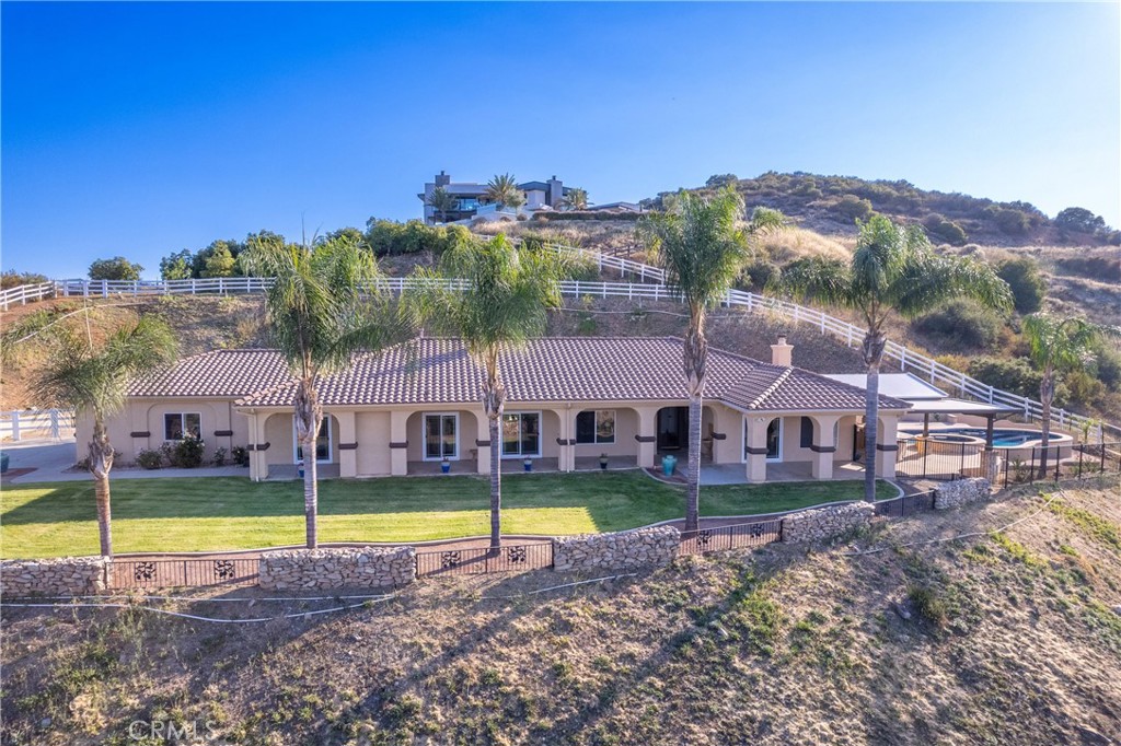 Single story La Cresta home close to the entrance! Experience unparalleled luxury in this meticulously maintained Mediterranean-style estate, boasting breathtaking panoramic views. Recently upgraded kitchen, vaulted ceilings and an open floor plan, this home is perfect for grand entertaining. Enjoy state-of-the-art amenities including a security system, intercom-speaker system, and a great room with a cozy fireplace. Supersized gourmet kitchen with new granite countertops and sleek tile flooring. The expansive master suite offers stunning city light views, complemented by a spacious main bathroom with a spa like tub. The property has areas ideal for horses, workshop, barn or toys. Step outside to your private oasis—a luxurious pool & spa, perfect for relaxing or hosting lavish gatherings. This property boasts some of the best views in La Cresta. You will have to come see for yourself. Private gated entry, citrus trees including orange, lemon & lime. One acre of Avocado trees.There’s plenty of space and flat land to add equestrian facilities, a guest house, ample parking, or simply enjoy the open space and tranquility. La Cresta is known for its peaceful, upscale living, and this property embodies that lifestyle. With breathtaking sunsets, mountain views, and ample room to roam, this estate offers a unique opportunity to live in harmony with nature—without sacrificing comfort or sophistication. Adjacent to La Cresta lies the Santa Rosa Plateau, a protected ecological reserve encompassing approximately 9,000 acres of preserved land. This sanctuary safeguards diverse ecosystems and local wildlife. The Santa Rosa Plateau’s commitment to conservation ensures that these landscapes remain undisturbed, offering a peaceful retreat and a glimpse into California’s natural heritage. Come see what La Cresta has to offer with nearby hiking, biking & horse trails.