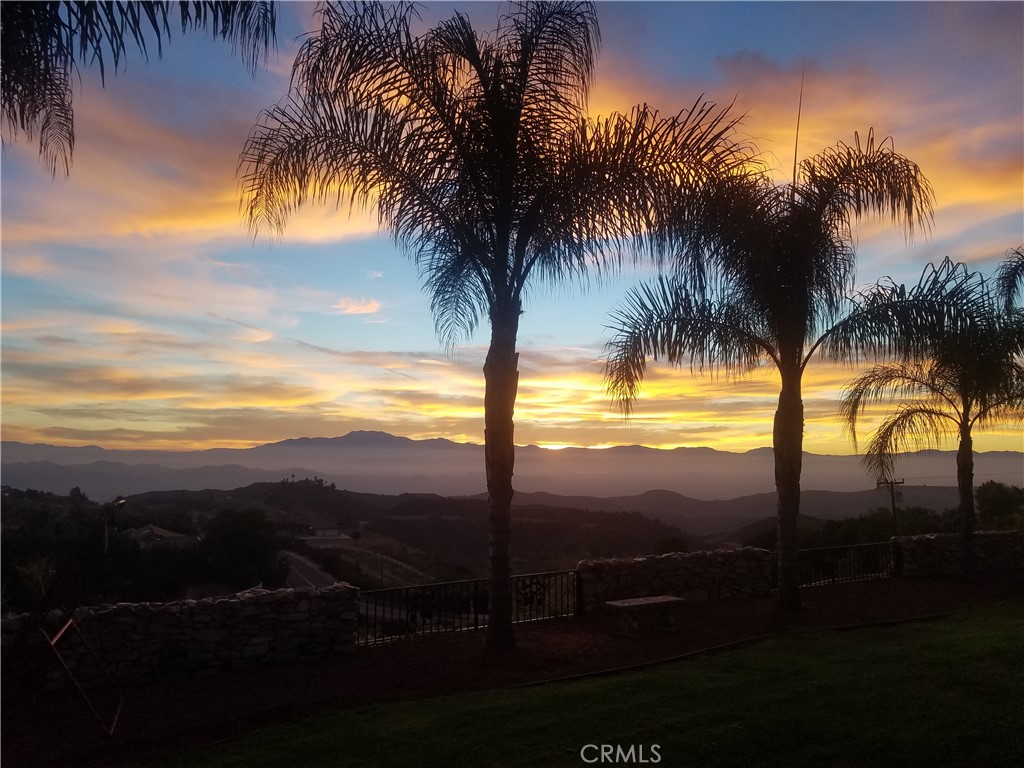 Single story La Cresta home close to the entrance! Experience unparalleled luxury in this meticulously maintained Mediterranean-style estate, boasting breathtaking panoramic views. Recently upgraded kitchen, vaulted ceilings and an open floor plan, this home is perfect for grand entertaining. Enjoy state-of-the-art amenities including a security system, intercom-speaker system, and a great room with a cozy fireplace. Supersized gourmet kitchen with new granite countertops and sleek tile flooring. The expansive master suite offers stunning city light views, complemented by a spacious main bathroom with a spa like tub. The property has areas ideal for horses, workshop, barn or toys. Step outside to your private oasis—a luxurious pool & spa, perfect for relaxing or hosting lavish gatherings. This property boasts some of the best views in La Cresta. You will have to come see for yourself. Private gated entry, citrus trees including orange, lemon & lime. One acre of Avocado trees.There’s plenty of space and flat land to add equestrian facilities, a guest house, ample parking, or simply enjoy the open space and tranquility. La Cresta is known for its peaceful, upscale living, and this property embodies that lifestyle. With breathtaking sunsets, mountain views, and ample room to roam, this estate offers a unique opportunity to live in harmony with nature—without sacrificing comfort or sophistication. Adjacent to La Cresta lies the Santa Rosa Plateau, a protected ecological reserve encompassing approximately 9,000 acres of preserved land. This sanctuary safeguards diverse ecosystems and local wildlife. The Santa Rosa Plateau’s commitment to conservation ensures that these landscapes remain undisturbed, offering a peaceful retreat and a glimpse into California’s natural heritage. Come see what La Cresta has to offer with nearby hiking, biking & horse trails.