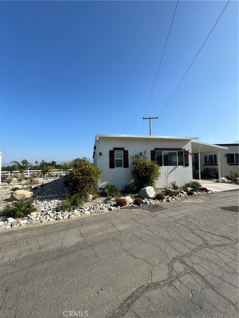 ***HAS ASSUMABLE LOAN WITH FIXED 3.99% RATE*** Gorgeous Almost New Manufactured Home! Come and see this stunning Turnkey home located in the hills of Calimesa. This manufactured home, built in 2023 boasts 3 bedrooms, 2 full bathrooms, beautiful upgraded laminate flooring and cabinets as well as quartz countertops! Step out to your patio for the endless rolling hills view! Located in Las Palomas Estates, a recently rebuilt manufactured home community offers access to a pool and spa, parks, and beautiful views. Located right off the 10 freeway and minutes away from the 210, 215, downtown Redlands and Yucaipa, this location is the centrally located and a quick drive to all of the inland empire! Come see for yourself as this will not last long!