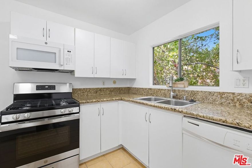 Move-in ready 3-bed, 2-bath condo with 1,030 sq ft of comfortable living in the heart of Tarzana. Located on the second floor, this freshly painted home features a spacious living room, a private kitchen separate from the living area, a primary suite with en-suite bath, and two additional bedrooms perfect for guests, family, or a home office. Recently installed central A/C, new roof, and a new oven add peace of mind. In-unit laundry hookups and two assigned tandem parking spaces offer convenience. A private balcony with extra storage completes the home.The gated Tara Village community offers a sparkling pool and spa, fitness center, BBQ/picnic areas, playground, and community laundry. Close to Ventura Blvd, 101 freeway, shops, dining, and schools. Schedule your tour today!