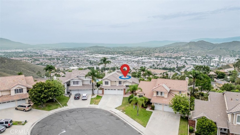 *PANORAMIC VIEWS*POOL/SPA*3 CAR GARAGE*CUL-DE-SAC*- Welcome to your newly REMODELED hilltop haven in picturesque Lake Hills where everyday will feel like a dream retreat. This one checks all the boxes -sitting at the end of a cul-de-sac, with inground POOL/SPA, and majestic views of the city lights below and surrounding hillsides. Step inside where you are greeted by an open airy floorplan ,soaring ceilings and lots of natural light. The gourmet kitchen is a chefs delight featuring sleek countertops, custom cabinetry and stainless steel appliances positioned to take in the stunning views outside, making everyday living and entertaining a joy. The adjoining living area features a cozy brick fireplace and more expansive windows where the sweeping views provide the perfect backdrop for relaxation or gatherings. A downstairs bathroom and laundry room provide added convenience. Upstairs you will find 4 bedrooms including a primary suite that is a true sanctuary with spa inspired bathroom and private access to your own view deck-perfect for morning coffee or evening sunsets. Additional bedrooms offer comfort and flexibility for family, guests, or home office along with an additional newly renovated full bathroom upstairs. This home is truly MOVE IN READY featuring thoughtful upgrades and custom touches throughout. Amazing location is not to be missed- make your appointment today and fall in LOVE!