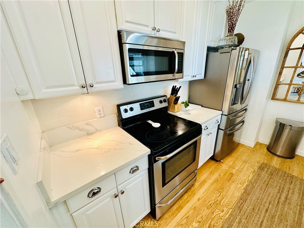 **All utilities included (water, power, gas, wi-fi, and gardner)** Welcome to this beautifully preserved 3-bedroom, 2-bath traditional home in the heart of Valley Village. Set behind a classic white picket fence and private front gate, this warm and inviting residence blends timeless 1940s charm with everyday comfort. Original hardwood floors, crown molding, a gorgeous bay window, and two decorative fireplaces add to the home’s character and elegance.
Enjoy spacious indoor living as well as multiple outdoor areas perfect for relaxing or entertaining. The fully fenced front yard offers added privacy and curb appeal, while the large grassy backyard gives you room to spread out and unwind.
A separate 1-bedroom, 1-bath guest house with its own private entrance is located at the rear of the property and is currently rented, offering a quiet and respectful shared setting.
Centrally located with easy access to the 101 and 170 freeways and just minutes from the NoHo Arts District, shopping, dining, and studios.
Pets welcome with additional deposit.
This is a rare opportunity to lease a true Valley Village gem. Reach out today to schedule a private showing!