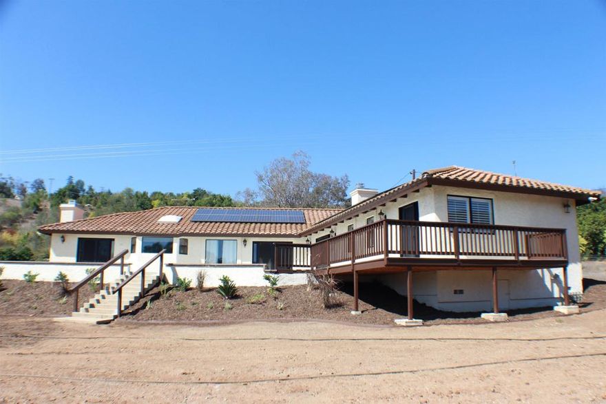Welcome to 33140 Lilac Road. This stunning single story home sits on 4.7 acres of mostly usable flat land, offering endless possibilities for horses, gardens, or future additions.  Recently refreshed! This dream home just received a fresh coat of paint inside and out, along with brand new landscaping featuring vibrant new plants and greenery.  As you step through the front door your greeted by an expansive view straight through to the backyard and open land beyond, creating a true feeling of space and tranquility.  Step inside you'll find 3 specious bedrooms all with their own walk-in closets and bathrooms, a versatile office with its own bathroom that could easily be converted into a fourth bedroom. Tile throughout the whole home, while the paid off solar makes for great energy savings.  Three car garage for plenty of parking or storage, fruit trees scattered throughout. Kitchen is equipped with stainless steel appliances and granite countertops.  Don't miss this opportunity to own your own piece of country living just outside the city.