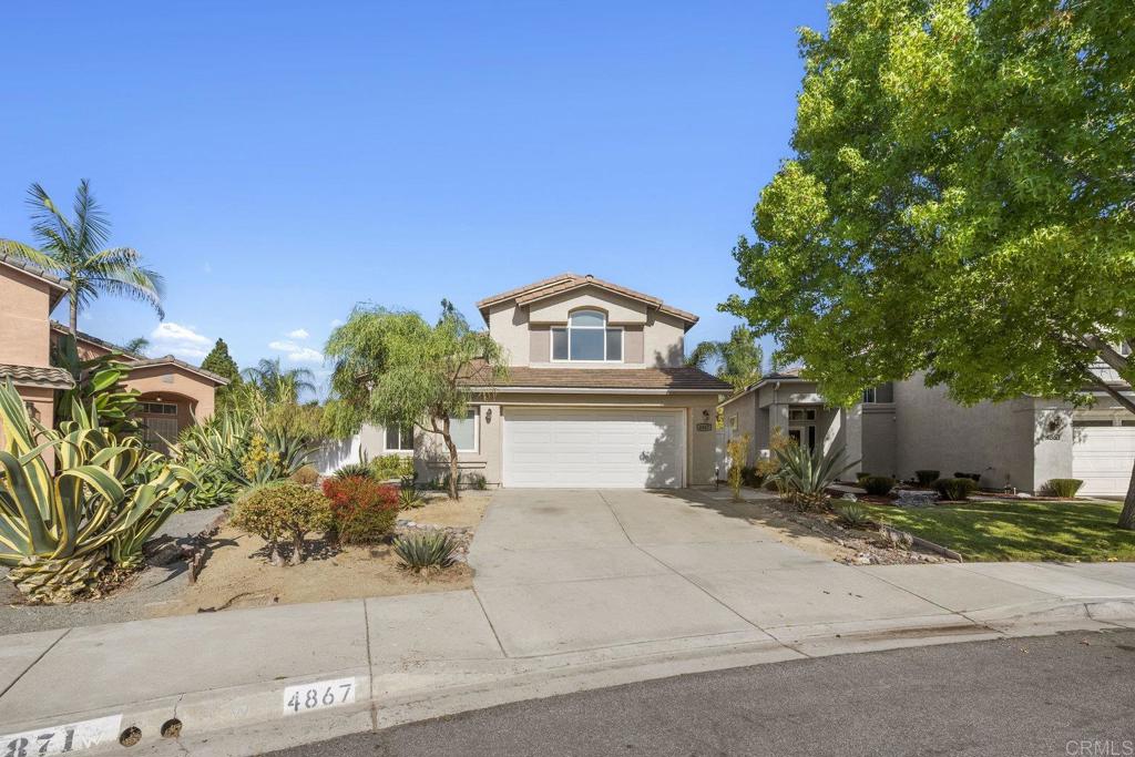 Welcome to this charming residence located in the highly sought after Rancho Del Oro Community of Oceanside. This impressive home boasts a generous layout of 4 bedrooms and 3 bathrooms within its well-utilized living space. From the moment you walk through the front door, you're greeted by high ceilings, wood look-like tile and luxury vinyl plank floors that enhance the open and airy atmosphere. The house has been freshly painted, adding to its clean, modern aesthetic. The efficient floor plan includes a convenient bedroom and full bathroom on the ground level. The kitchen will inspire your inner chef with its quartz countertops, high efficiency induction oven and range, stainless steel appliances, hi-arc faucet and pendant lights. The side-by-side washer and dryer offer added convenience for your daily routine. The primary en-suite bathroom features dual sinks and a designer tile bathtub surround providing a spa-like retreat within your own home. Ample storage throughout the property guarantees clutter-free living while mirrored closet doors add depth to each room. Energy efficiency is prioritized with owned solar panels and dual pane windows. Two EV charging ports in the spacious two-car garage further enhances this eco-friendly home's appeal. Energy efficient 50 gallon water heater and fiber optics internet. Step outside to enjoy a generously sized backyard which offers plenty of space for outdoor entertaining or simply cozy up by the fireplace. Oceanside's desirable location provides easy access to shopping centers and diverse dining options nearby. Take advantage of all that coastal living has to offer including beautiful beaches, parks, hiking trails, golf courses and more! This property is not just about owning a home; it's about embracing a lifestyle. A Must See!