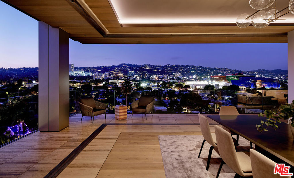 Welcome to Jr Penthouse 9A. This exquisite 3 bedroom/4.5 bath residence at 8899 Beverly perfectly showcases the remarkable craftsmanship that defines this iconic West Hollywood property. The high-floor corner location enjoys coveted, uninterrupted north-facing views of the Hollywood Hills and includes a private Auto Stable in our show-room style garage. At nearly 4000sf, 8A is our largest 3-bedroom floor plan, featuring soaring 11-foot ceilings which create a sense of volume and light. Floor-to-ceiling operable glazing by Vitrocsa opens the entire expanse of the dining and entertaining areas, with Italian travertine exterior terraces seamlessly transitioning to the interior. Adjacent to the central entertaining area, the spacious media room is ideal for movie nights and moments of relaxation.The primary suite is a haven of privacy, featuring floor-to-ceiling operable glass that connects to a secondary private terrace. Dual bathrooms and walk-in closets, along with a soaking tub against a glass backdrop, make this suite a true retreat. Both north-facing guest rooms also enjoy stunning views of the Hollywood Hills, complete with ensuite baths and closets. Residence 8A offers an abundance of closet and storage space, including a generously sized laundry/utility room. The custom-designed chef's kitchen is a masterpiece, equipped with top-of-the-line Meile, Gaggenau, and Sub-Zero appliances, complemented by custom cabinetry and marble countertops. Crafted by Olson Kundig Architects, 8899 Beverly stands as an iconic collection of 40 Tower Residences, each representing a unique expression of luxury living. The attentive staff ensures a five-star living experience. Amenities include 24-hour concierge and valet services, a fitness center, and a quarter-acre oasis with a resort-style pool, spa, fireplaces, and a custom outdoor kitchen. Within a short walk, you'll discover premier dining and shopping destinations. An exciting addition to the building is Stella's Restaurant, a collaboration between renowned restaurateur Janet Zuccarini and Executive Chef Rob Gentile, enriching the exceptional lifestyle offered at 8899 Beverly. A private auto stable with parking for 2 cars, in addition to 2 valet spaces, allows the Jr Penthouse to store up to 4 vehicles in the garage. HOA dues include earthquake insurance, water, gas, and a host of services and amenities- we invite you to explore the full offering of this West Hollywood oasis.