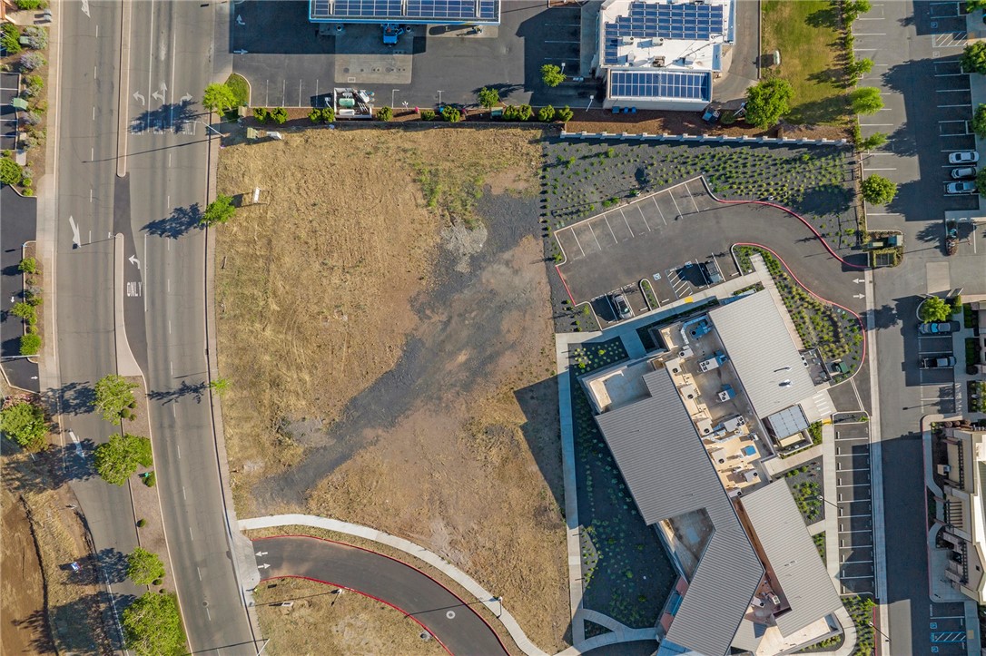 This commercial lot fronts Bruce Road and sits in an ideal location between Skyway and 20th St. in Chico. The area has seen and will continue to see vast growth and development. The newly finished four-lane Bruce Rd allows for easy access for both Chico and the town of Paradise. Predominately surrounded by professional office and medical, this lot is primed to host your business. Development in the area includes Meriam Park, large residential subdivisions that include single family and muli-family, commerical businesses, a new school, parks, and recreation areas that will need services your business can provide. Neighboring businesses include, Orothopedics Associates, Enloe, Adventist Health Physical Therapy, Skyway Medical and more. Be apart of the new growth area in Chico! The adjacent lot of .06 acres is available and listed for sale if needing additional buillding area.
