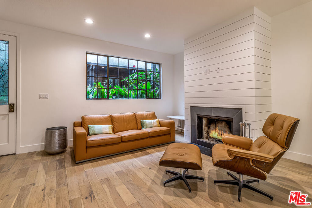 Seller extremely motivated, all reasonable offers considered! This extremely rare 3 level (with interior elevator) Santa Monica gem has been gorgeously remodeled, featuring an open kitchen with stainless appliances and an awesome third floor master suite, complete with massive walk in closet and outdoor terrace. If need be, den/office could serve as a 3rd bedroom. An unusual greenspace with no immediate building to the East provides ample light, privacy and a tranquil setting. Includes beautiful oak floors, central AC, and parking/storage for two. All of this in one of the most highly desired Santa Monica neighborhoods...less than a block from Ocean Avenue and a palm tree lined park.