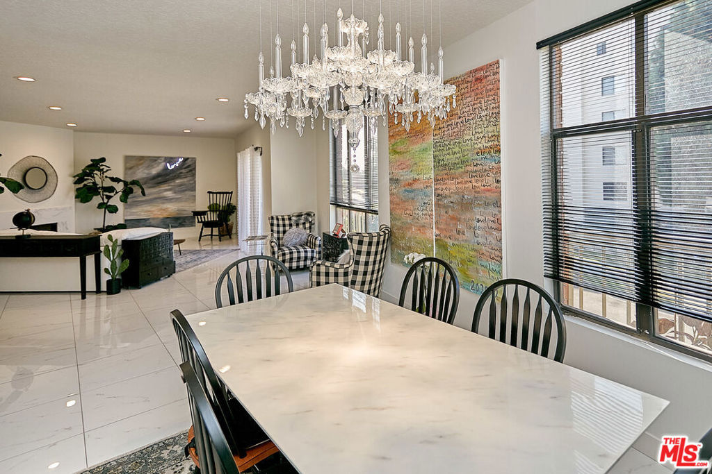 Elegantly renovated, this spacious 2-bedroom, 2.5-bath residence is located in the highly sought-after Chateau Fremont, a boutique 18-unit, 3-story building perfectly positioned near Hancock Park, Koreatown, Larchmont Village, and Paramount Studios. Offering 1,662 sq. ft. of refined living space, the home features an expansive living room with a cozy fireplace, a sun-drenched balcony, and an inviting dining area perfect for relaxing and entertaining. The kitchen includes a charming breakfast nook, while the impressive primary suite boasts a generous walk-in closet and a spa-inspired bath with double sinks and a spacious shower. A secondary bedroom with its en-suite bath provides comfort and privacy for guests. Additional highlights include in-unit side-by-side laundry, two side-by-side parking spaces in a secure gated garage, and the convenience of a central location close to shopping, dining, and entertainment.