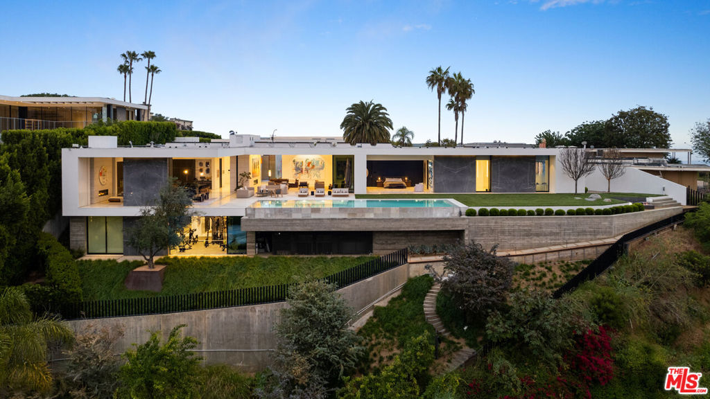 A stunning piece of architecture designed by XTEN Architects and recipient of the AIA Los Angeles Award for most influential architecture of 2020. Inspired by Stanley Kubrick's Space Odyssey and set on a promontory on the most prime cul-de-sac in the Bird Streets. Enter through a private courtyard into high ceilings infused with natural light, walls of glass and polished terrazzo floors. Stylish and sophisticated with incredible walls for art, the property offers jetliner views overlooking Los Angeles to the ocean. Large living room, incredible kitchen/family room, professional theater, gym, dance studio, office, and much more. There is an incredible primary suite with dual closets and huge spa-like bathroom with steam shower and soaking tub. The entire house overlooks a spectacular infinity pool and large grassy yard. Additional amenities include an 8-car subterranean showcase garage. Show to pre-qualified clients only.