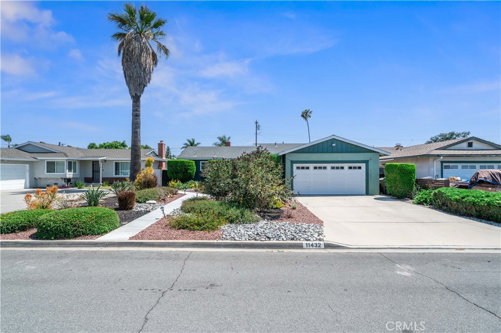 Welcome to 11432 Presidio Way, a beautifully updated 3-bedroom, 2-bathroom home in the heart of Garden Grove. This charming property blends modern style with comfortable living, offering a truly inviting atmosphere. The interior boasts newer flooring throughout, fresh paint, and plenty of natural light that highlights the open and airy feel. With a vaulted ceiling in the living room and a cozy brick fireplace, it’s easy to imagine relaxing in this space after a long day. The spacious kitchen is perfect for those who enjoy cooking and entertaining. With a convenient breakfast bar that opens to the dining room, you can easily connect with guests while preparing meals. Both bathrooms have been thoughtfully renovated, offering a sleek and updated look that complements the home’s overall style. Step outside to your private backyard oasis, where you’ll find low-maintenance artificial turf and newly designed hardscaping. The generous space is perfect for hosting large gatherings or simply enjoying quiet, peaceful moments. Whether you're hosting friends or unwinding alone, this backyard is your personal retreat. Other notable features include newer dual-pane windows, which improve energy efficiency and enhance the home’s overall comfort, as well as a 2-car garage for added convenience. With water-conserving landscaping, this home is both eco-friendly and cost-effective. Located in a desirable Garden Grove neighborhood, 11432 Presidio Way is an exceptional place to call home. Don’t miss out—schedule a showing today and experience everything this home has to offer!