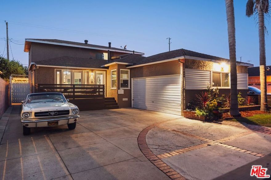 Located in one of Culver City's most desirable neighborhoods west of the 405, this traditional turnkey home is ideal for families. Gated and secure, the residence offers 4 bedrooms, 3 bathrooms, and over 2,000 square feet of living space. Upon entering, you're welcomed by the main living areas: a bright living room with sliding glass doors for seamless indoor-outdoor living, and a designated dining room that opens to the front deck patio, flowing naturally into the kitchen and laundry room. The kitchen is outfitted with quartz countertops, shaker-style cabinetry, stainless steel appliances, and countertop seating, perfect for entertaining or casual dining. The lower level hosts three bedrooms and two full bathrooms. Upstairs, the primary suite enjoys its own secondary living room/flex space, a private balcony, generous closet space, and a recently updated en-suite bathroom. Outside, a large pool and expansive patio provide the perfect setting for year-round entertaining. Conveniently located near Playa Vista, Venice, and downtown Culver City, 5215 Emporia Avenue offers the perfect blend of functional Westside living in a secure neighborhood at the gateway to tech-rich Silicon Beach.