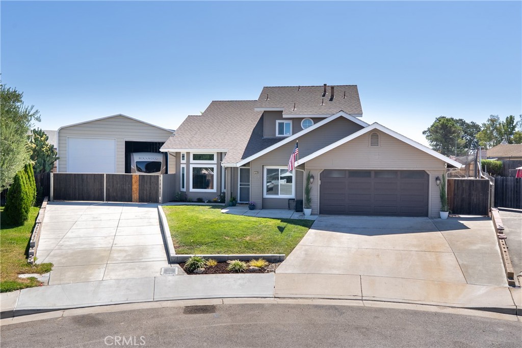 Tucked at the end of a cul-de-sac on a 1/3-acre lot, this upgraded 4-bedroom, 3-bath home offers 1,900 sq. ft. of living space near the Paso Robles Golf Course and Almond Acres Charter Academy. The interior features LVP flooring throughout, neutral paint colors, and Milgard Trinsic Series windows that bring in natural light. The living areas include a cozy family room with vaulted ceilings, plus a bedroom and ¾ bath on the lower level. The kitchen is appointed with custom concrete counters, a tile backsplash, and stainless-steel appliances. Upstairs, the spacious primary suite offers vaulted ceilings, a walk-in closet, soaking tub, updated vanity, and access to a new private deck, while two guest bedrooms and a shared bath complete the upper floor. Outside, the expansive yard offers something for everyone with a built-in firepit, batting cage, raised garden beds, and plenty of room for a pool. A 37’ x 27’ RV/boat garage with hookups and dual roll-up doors provides easy access and storage, complemented by a tool shed on slab. Energy efficiency comes from a 5.5kW owned solar system with individual panel inverters, maximizing performance and helping to keep utility costs low year-round. The seller is also offering a closing cost credit, giving buyers added flexibility. Don’t miss this opportunity to own a versatile Paso Robles property with space, upgrades, and functionality - schedule your showing today.