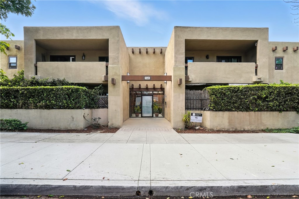 Welcome to 940 E 3rd St, #10, Long Beach. This beautifully updated Spanish style condo is just three blocks from the beach. With its two story layout, it lives more like a townhouse and offers the perfect blend of charm, comfort, and convenience in the heart of Downtown Long Beach. Step inside the front door and into the inviting living and dining area, featuring bamboo floors and abundant natural light. The updated kitchen showcases quartz countertops, wood shaker cabinets, stainless steel appliances (INCLUDED) and modern finishes. A downstairs half bath makes hosting guests effortless, while a sliding glass door from the dining area opens to a spacious private patio complete with a doggy door making this the perfect place for entertaining or relaxing outdoors. Upstairs, you’ll find two bedrooms, including one with a generous walk in closet and a full bathroom with a shower/tub combination. Additional highlights include central air and heat with a newer furnace, a Nest thermostat, a secured building entrance and updated windows throughout. Parking is a breeze with two dedicated spaces that include one PRIVATE garage and one secured carport. The community is well maintained by a proactive HOA, giving you peace of mind and pride of ownership. All of this, just moments from the beach, shops, dining, and everything vibrant Downtown Long Beach has to offer.