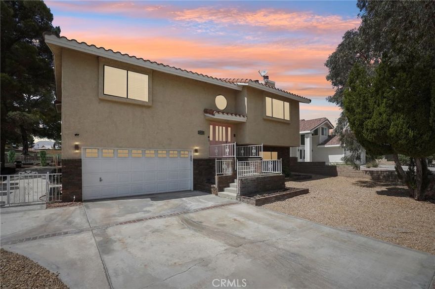 Welcome to 14753 Blue Grass Dr in Helendale, a fully renovated two-story home in the desirable Silver Lakes community. This residence features new flooring, fresh paint, upgraded countertops, modern hardware, recessed lighting controlled by phone app, wooden blinds, and new ceiling fans throughout. The kitchen comes with newer appliances, including a built-in induction grill, and all mounted TVs remain with the home. The downstairs level offers a convenient kitchenette with a wine fridge, small refrigerator, and freezer, making it perfect for entertaining. The master suite includes an updated bathroom with new countertops, while additional highlights include a mini-split system, multiple fireplaces, a heated pool, and an attached two-car garage. Set on an near the golf course, this property combines comfort, style, and access to community amenities such as a private lake, parks, and clubhouse.