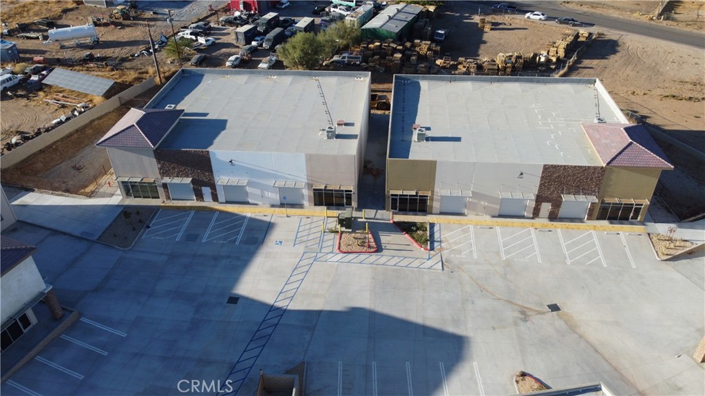 Building B is ±7,820 Sq. Ft. and includes three (3) ground level roll up doors and two (2) built out offices at each end of the building. Potential to divide the space in half.