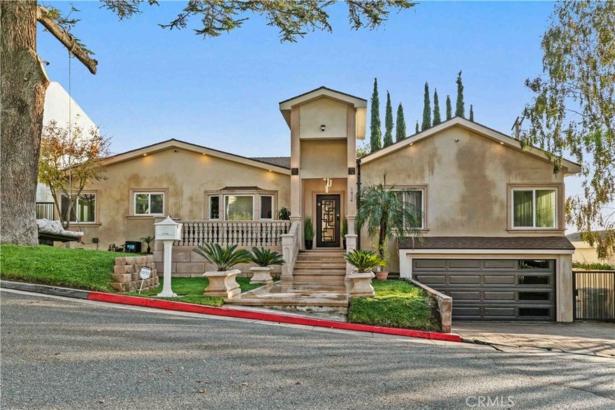 This beautifully renovated 3-bedroom, 3.5-bath home offers modern luxury and move-in readiness in the sought-after Verdugo Woodlands. Featuring elegant marble flooring and an open-concept design, the home boasts a spacious living room with a cozy gas-burning fireplace and a separate dining area that opens to a balcony overlooking the serene backyard—perfect for entertaining or relaxing.