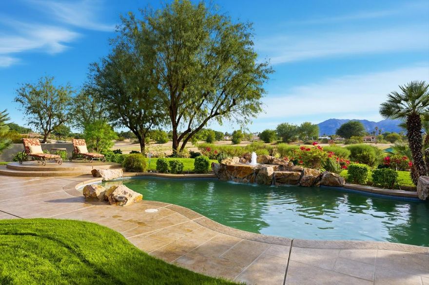 Perfectly positioned on one of the most coveted settings in PGA West, this homeshowcases the highly sought-after Ventana open floor plan with a rare triple fairway panorama and magnificent south-facing mountain views. This exceptional vantage point delivers unmatched scale, light, and serenity--an elevated offering within the prestigious Greg Norman enclave. The grand greatroom serves as the heart of the home, blending generous living and dining spaces with seamless indoor-outdoor flow. Expansive glass captures the dramatic fairway and mountain backdrop, creating an ever-present connection to the landscape. The chef's kitchen is beautifully appointed with rich cabinetry, slab-granite surfaces, a large center island, and a dedicated wine cooler--ideal for refinedentertaining and relaxed everyday living. The primary suite is a luxurious retreat, thoughtfully oriented to take in the sweeping southern views. It offers direct patio access, a spacious bedroom area, and a spa-inspired bath featuring dual vanities, a soaking tub, a large shower, and an oversized walk-incloset. Two additional guest suites offer comfort and privacy, each featuring its own well-appointed bathroom.A custom-built-in office offers a polished, functional workspace, while the separate bonus room with a Murphy bed enhances versatility--perfect for additional guests, hobbies, or a quiet retreat. Outdoors,the expansive patio becomes a sanctuary of its own. The dramatic triple fairway setting and striking mountain silhouette create a sense of openness and tranquility rarely found in PGA West.  A sophisticated Ventana plan home distinguished by elegant appointments, exceptional flexibility, andone of the community's most remarkable view locations--an extraordinary opportunity within PGA West