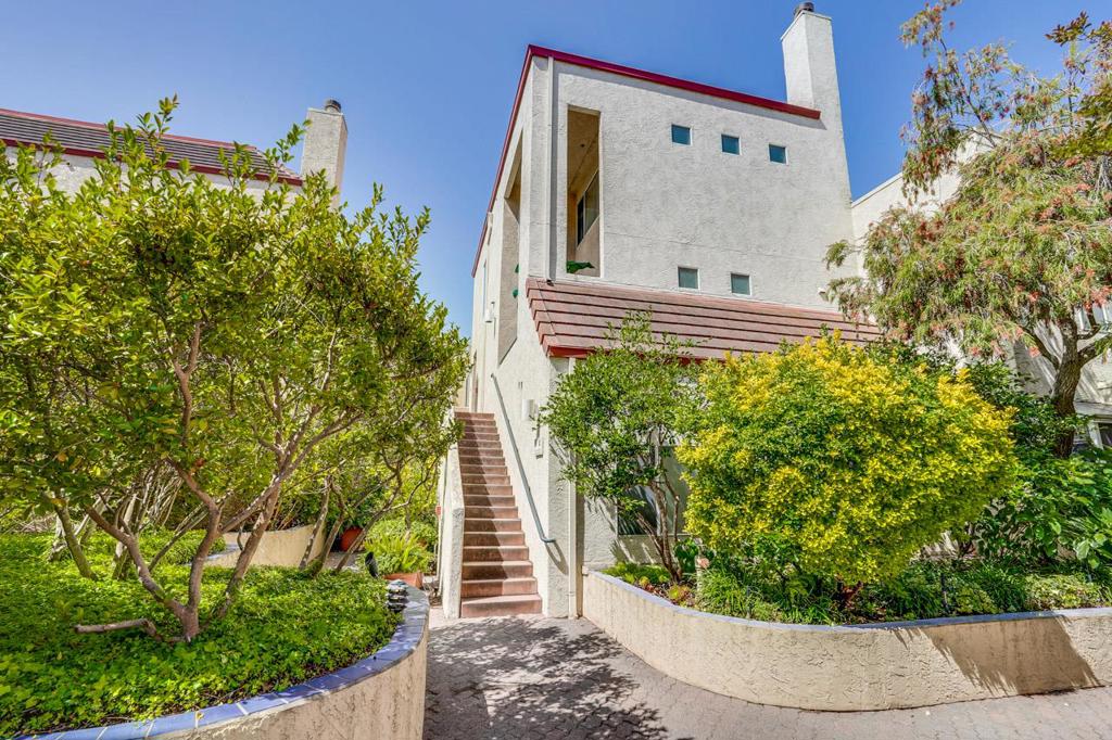 Elegant and spacious, this top-floor, two-level end-unit condo is located in the highly desirable newer side of Palo Alto Central - just steps from California Avenues shops, restaurants, Caltrain Station, Mollie Stones Market, and the Sunday Farmers Market. This bright and airy home features gleaming laminate wood floors, a cozy fireplace, a private balcony off the living room, and a modern kitchen with stainless steel appliances. The layout includes two large primary suites upstairs, each with its own full bath, plus a convenient half bath on the main level. In-unit laundry sits between the bedrooms, and central heating and air conditioning provide year-round comfort. The unit also includes one assigned underground parking space and access to the community pool. With close proximity to Stanford University, Oregon Expressway, and major tech employers, this home offers the perfect blend of location, comfort, and lifestyle.