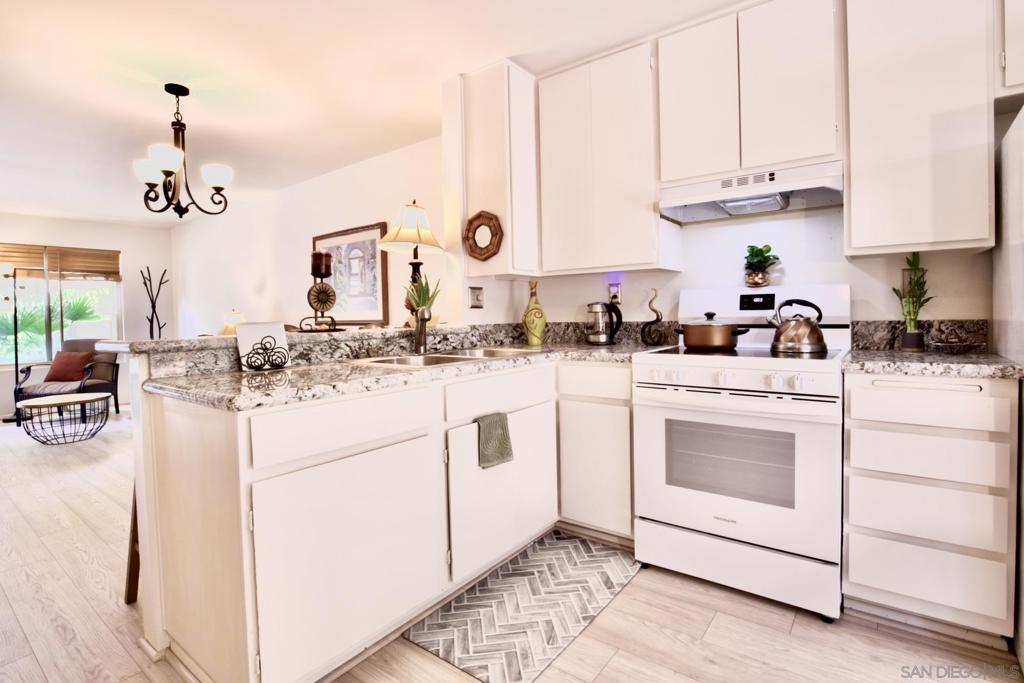 Stop Renting. Start Owning in San Carlos. Why rent when you can own this updated, move-in-ready 2-bedroom, 1-bath townhome-style condo in one of San Diego’s most desirable neighborhoods—San Carlos! Whether you're buying your first home or investing in a high-demand rental area, this is the kind of opportunity that doesn't come around often.Inside, you’ll find stylish upgrades throughout—new laminate wood flooring, granite countertops, dual-pane windows, and a private, fenced-in covered patio that opens to a peaceful greenbelt. It’s the perfect spot to sip your morning coffee or unwind after a long day. The smart two-story layout offers comfort and privacy, with two spacious bedrooms upstairs and easy living downstairs. But what really sets this home apart is the lifestyle. Just across the street is Mission Trails Regional Park, with over 60 miles of hiking and biking trails to explore. Cowles Mountain and Lake Murray are just minutes away—ideal for outdoor lovers and weekend adventurers. Plus, you're close to shopping, dining, and freeway access, making daily life effortless. This isn’t just a home—it’s your ticket to owning a piece of San Diego. Don’t miss your chance to build equity, gain freedom, and enjoy everything San Carlos has to offer.