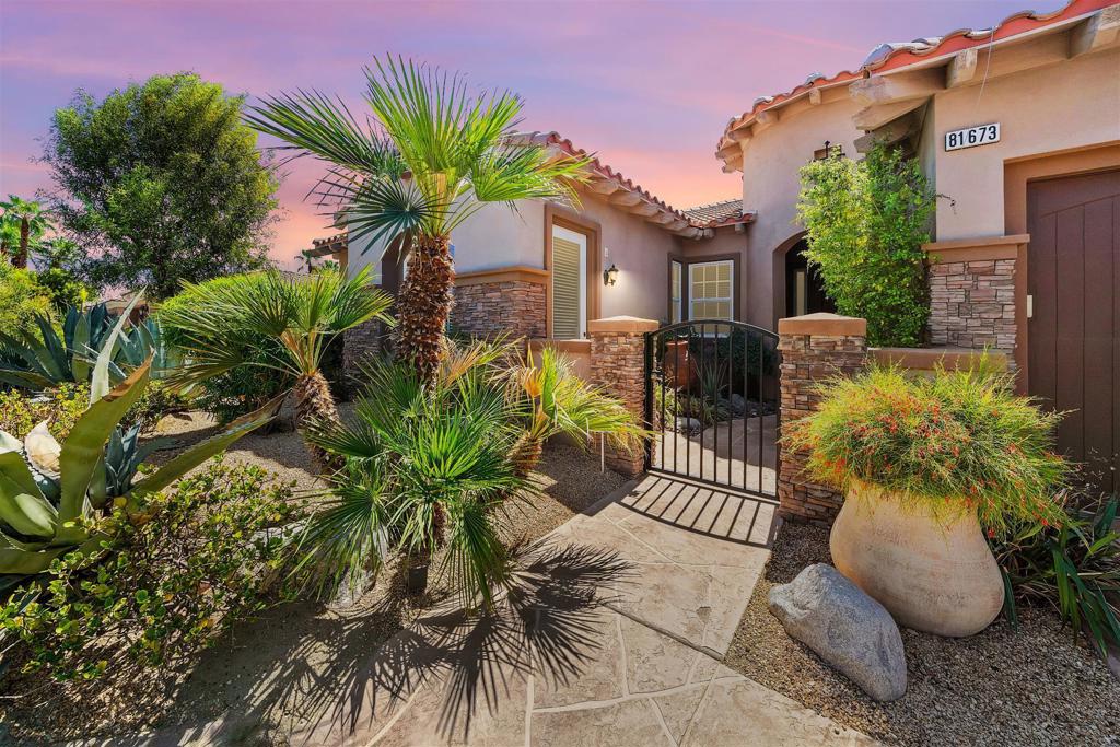 Welcome to your personal retreat in the desert. Located immediately adjacent to the exclusive Madison Club. This stunning 3 bedroom 3.5 ensuite bathroom home with huge built-in custom cabinetry in master and dressing area plus dual vanities, huge shower and separate spa tub. It is located in the sought after Rancho Santana neighborhood, blending comfort privacy, fully furnished resort style living. Step inside to find a spacious open floor plan with abundant natural light, and seamless indoor outdoor flow. Each bedroom offers its own private ensuite bath, making it perfect for guests or multigenerational living. The kitchen features granite counter tops, stainless steel appliances, and a large island and walk-in pantry plus plus matching granite top dining table ideal for entertaining or casual family meals. The family room is open to the kitchen area for ease of conversation among friends and guests. The open living room area includes a wet bar that opens directly to a beautifully landscaped yard designed for privacy and relaxation. Enjoy the private pool and spa built for six, surrounded by trees and mountains. Perfect for warm weather desert days and starry nights. Whether you are hosting a gathering or enjoying a quiet evening, the covered patio with auto drop down awning and outdoor lounge area with custom built BBQ create the ideal setting. Additional highlights include newer Central AC and heating, new pool heater, attached 3 car garage, low maintenance desert landscape, and it is located minutes from world class golf, Old Town dining with boutique shopping, plus the nearby famous Coachella and Stagecoach Musical Festivals. This home is perfect as a primary residence or a vacation getaway. Don't miss a chance to own a slice of this verdant oasis paradise in the Coachella Valley. This is a unique home with many builder upgrades beginning with the privately gated and stoned facing which includes both front door and separate casita entrys as you walk along the stone pathway leading into the palatial rotunda foyer... I hope you will come visit Rancho Santana with its multiple parks, putting green, bocce ball court, big pergola and BBQ plus playground and more for all you and your neighbors, family and friends to enjoy. This truly impressive community with low HOA dues is a delightful place to experience. I live here and can answer all your questions so just call me.