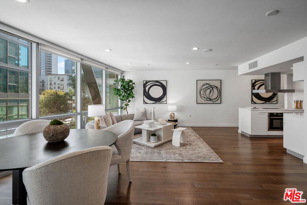 From the floor to ceiling walls of glass enjoy epic views of the Los Angeles cityscape and skyline, and twinkling lights at night. This bright and immaculate unit features In-Unit Laundry, A new Central Air Conditioning system (sept. 2025), updated lighting, fresh paint, hardwood flooring, sleek german crafted modern kitchen with Quartz counters, designer washrooms with stone tile floor, and a 240 sq. foot private outdoor terrace exclusively for this unit with BBQ and outdoor seating. With a low HOA of 540$ per month that includes many utilities, parking, Salt water pool, Spa, fitness center, all a short distance to LA Live, Staples Center, FIDM, fine dining, arts, entertainment, & public transportation. Concerto Lofts offers exceptional contemporary living that blends art, architecture, & the vibrant energy of DTLA!