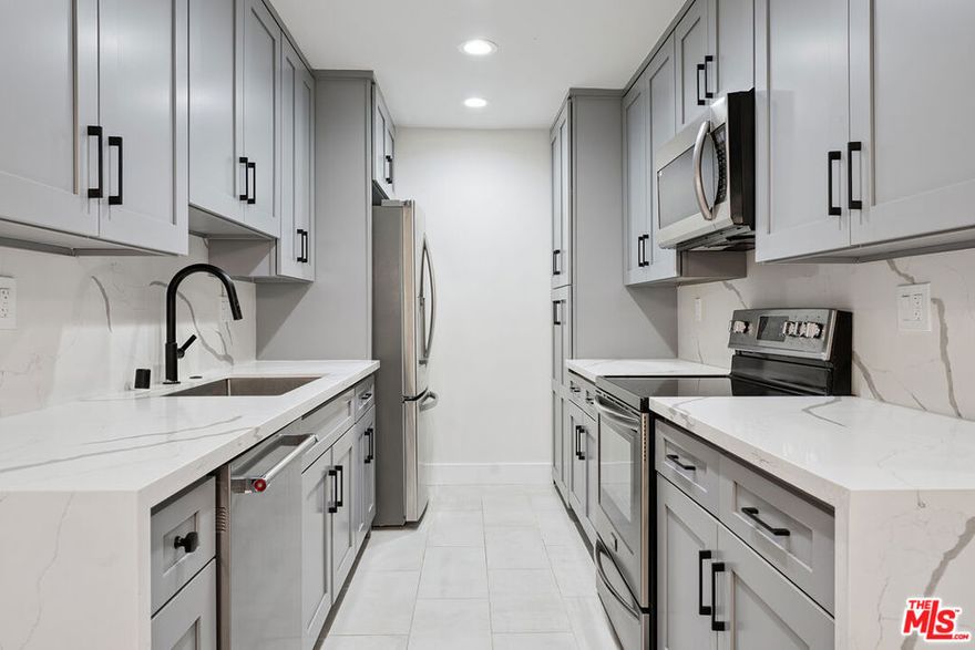 Welcome to this fully remodeled 2BR 2BA first floor unit in the Newcastle Manor Condo Association. This stylish unit features new waterproof laminate flooring throughout, recessed lighting throughout, fully updated kitchen with stainless steel appliances and quartz countertops. Primary bedroom with recessed lighting, walk-in closet and updated bathroom. Large guest bedroom with recessed lighting and a wide closet. This unit features one of the buildings 4 extra large covered patios, great for hanging out or gardening. This is one of the larger 2 bedroom floorplans with a large living area that can be set up in multiple ways, great for entertaining. Easy first floor access near the lobby. 2 covered tandem parking spaces. Association amenities include a recently replastered sparkling pool, fitness room, laundry room, gated parking and controlled access.