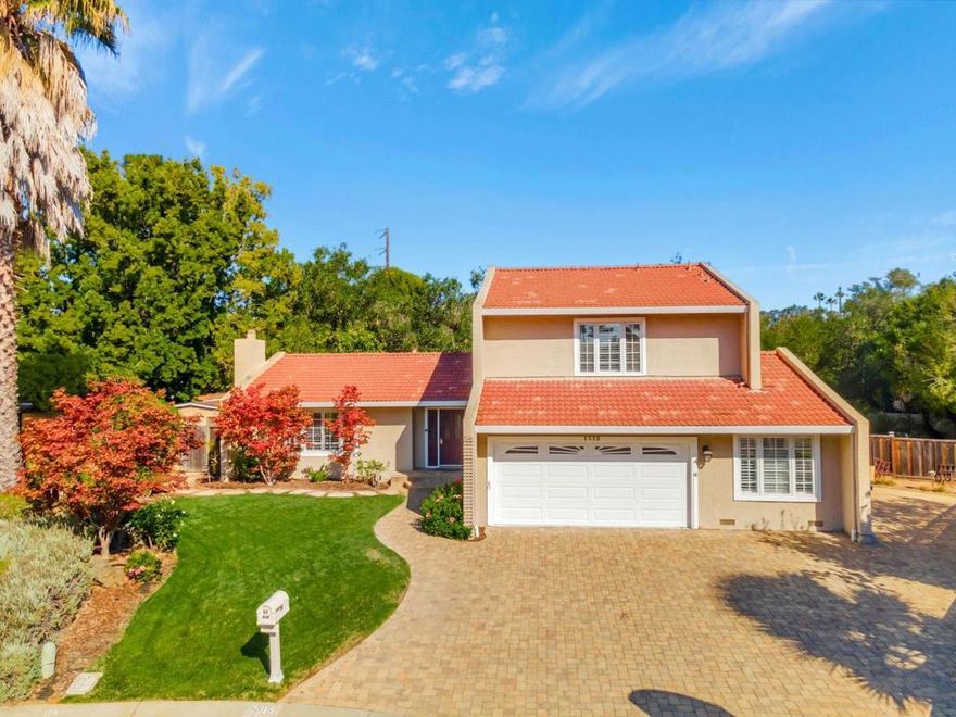 Nestled on a peaceful court in sought-after Los Altos, this beautifully upgraded 5-bedroom, 3-bathroom home offers 2,477 sq ft of living space on a generous 9,890 sq ft lot. Step through the formal entry into the inviting family room featuring a cozy fireplace & sliding door that opens to the backyard. A separate living room w/ vaulted ceilings, fireplace, dining area, & additional slider provides the perfect setting for gatherings. The gourmet kitchen is equipped w/ a Thermador gas range/oven, stainless steel appliances including dishwasher, micro-hood, & refrigerator, plus maple shaker cabinetry, granite slab counters, center island w/ extra storage & power outlets, & a bay window breakfast area. Two bedrooms, a full bathroom, a dedicated laundry area, & convenient access to the garage w/ opener complete the downstairs. Upstairs, the sun-filled primary boasts vaulted ceilings, two closets, & en-suite bathroom w/ granite counters, separate vanity area, & stall shower. Two additional upstairs bedrooms share a hall bath w/ dual sinks, granite counters, tile flooring & large stall shower. The landscaped yard includes a built-in outdoor kitchen w/ gas grill, granite counters, sink, & refrigerator, plus elegant pavers, lush lawn areas, & pergola w/ lighting for outdoor dining.