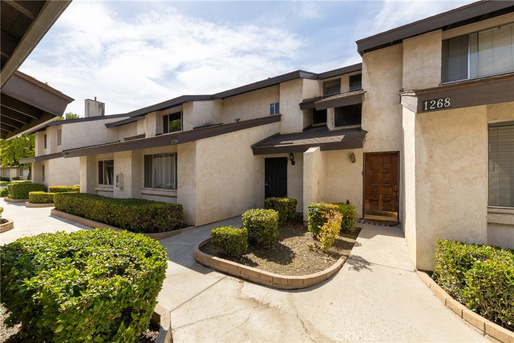 This beautiful two bedrooms, two full bath townhouse is located in desirable area of Colton near Loma Linda medical facilities. 1,472 square feet of spacious plan is well organized with one bed room down stairs and the massive master bedroom upstairs. The kitchen and the living room area on the main level are well appointed for comfortable living. Laminated wood flooring throughout the unit making it easy to clean and gives the modern appeal. The entire interior is freshly painted. Recessed lighting in the hallway and the kitchen for brightness and modern look. Upstairs laundry room is for full-size washer and dryer. Unlike many other community living, this unit offers a detached one-car garage and plenty parking spaces are available for guests . This highly desirable location is close to schools, hospitals, shopping, dining, and easy access to major freeways for commuters. Well-managed HOA offers a pool and spa to cool you off and it has secure mailroom to protect you mail. It is available now. Come and let your eyes witness how beautiful and functional this unit is for you and your family. Pictures will be posted shortly