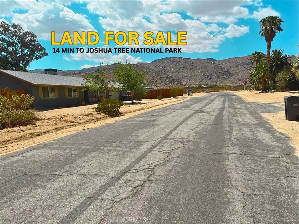 Seller may offer financing. Imagine your desert home or Airbnb vacation rental on this buildable 0.34-acre lot with beautiful mountain views and no neighbors behind for extra privacy. Situated on a street with developed homes, this lot is just 8 minutes from the famous Joshua Tree Visitor Center and 14 minutes from the park entrance. For your outdoor adventures, Forty-nine Palms hiking trail is only 5 minutes or 1.5 miles away, offering a serene desert hike surrounded by palms, and 7 minutes to Indian Cove Campground and Hiking trails. Groceries, schools, and charming downtown Twentynine Palms are all within 5-10 minutes. With utilities close and flat land ready to build, this property is a great place to create your desert retreat or rental investment. Closest house address: 6743 Galleta Ave, Twentynine Palms, CA, 92277 and 6773 Galleta Ave, Twentynine Palms, CA, 92277. Land located in between those 2 house addresses.
