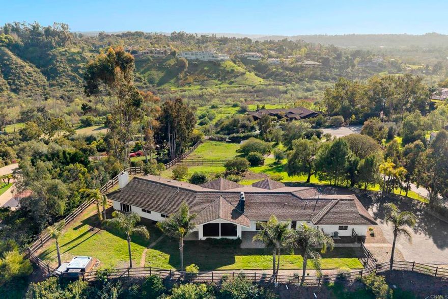 Perched atop 2.54 acres in the prestigious Rancho Santa Fe Covenant, 16551 Zumaque offers breathtaking panoramic views and a charming single-level residence with ample space for recreation on the spacious grounds. This exceptional property is a rare opportunity for those seeking to call Rancho Santa Fe Covenant home. The serene surroundings provide a sense of privacy and tranquility, while still being just minutes from the renowned Rancho Santa Fe Golf Club, top-rated Roger Rowe School, and the charming Village of Rancho Santa Fe.