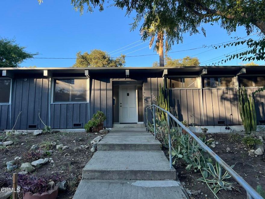 Rare and amazing 3-bedroom, 2 bath main house plus a 350 square foot detached studio with 1 bath and efficiency kitchen.  The studio is perfect for guests,  in-law, teens, office, work-out, hobby or game room.   The moment you walk into the main house, you will love the many architectural elements that make this mid-century custom home so unique.  It is very Frank Lloyd Wright-ish.  In the living room, you have a wood burning fireplace and a wall of windows that faces the closed-in rear patio featuring another brick fireplace and the studio.  On the left, the roomy galley kitchen includes a dishwasher, disposal and loads of cupboard space.  We can include a gas range if desired.  The refrigerator space is plumbed for an icemaker.  There is a laundry room with gas hook-ups.  The back door leads to single car garage with storage cabinets.  Dining area has sliding glass door to patio.  The patio is completely fenced has a natural gas hook-up for your BBQ.  The opposite end of the house features three (3) bedrooms with two facing the patio.  There is a full bath with tub-over shower.  The second bathroom features a shower stall.  Hot water is provided through a tankless water heater.  The home has new HVAC and lovely wood flooring throughout.  All is situated on a corner lot with loads of street parking and professionally managed by Crown Mark. Won't last contact us today to show