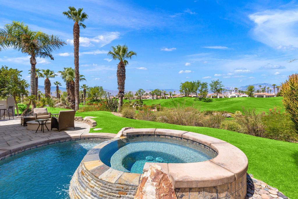 Welcome to this spectacularly remodeled Bougainvillea 1 at Indian Ridge Country Club, a showcase property offering 2,430 sq. ft. with 3 bedrooms and 3.5 bathrooms. Every detail of this home has been thoughtfully updated, from the paved driveway and desert landscaping to the fresh interior finishes, creating a residence that is truly move-in ready. Set against a backdrop of double fairway and San Jacinto Mountain views, this home is a desert retreat like no other. Enjoy unforgettable sunsets from your private patio featuring a dipping pool, spa, built-in BBQ, and fire pit, perfect for relaxing evenings or entertaining guests. Inside, modern elegance shines with quartz countertops, newly tiled showers, new flooring, and a serene primary suite designed for ultimate comfort. Additional modern upgrades include newer A/C units, Nest thermostats, remote door entry, and an air-conditioned epoxy-floored garage. Offered fully furnished per inventory, this home is the complete package. Located along the 5th and 6th holes of the Arroyo Course, this property pairs luxury living with resort-style amenities. Indian Ridge Country Club offers two Arnold Palmer signature golf courses, a state-of-the-art fitness center, tennis and pickleball courts, a full-service spa, and multiple dining venues. Don't miss your opportunity to own a slice of paradise in Palm Desert's premier country club community.