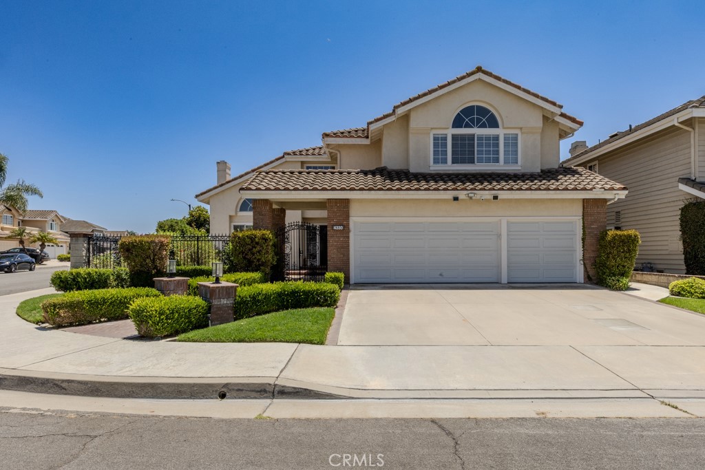 Welcome to this bright, beautiful, move-in-ready home on a sunny corner lot in Belmont Estates. Upon entering the home, you’re welcomed by high ceilings, a stunning chandelier, and an open floor plan with abundant windows that fill the space with natural light. The private living and dining rooms feature elegant hardwood floors and a cozy fireplace, and travertine flooring flows through the main areas for timeless style.
An expansive family room with its own fireplace opens seamlessly to the modern kitchen with quartz countertops, double ovens, a center island, a dining nook, and a premium Bosch cooktop. A stylish bar with a wine fridge and designer backsplash elevates every gathering and is ideal for entertaining. A desirable main floor bedroom provides flexible living for guests or multi-gen needs. Upstairs, the spacious primary suite offers a cozy sitting area and a luxurious en-suite bath with a glass shower, an elegant freestanding soaking tub, dual vanities, and a large walk-in closet. In addition, the second floor also features two large bedrooms and a versatile, oversized bonus room with modern built-ins and a walk-in closet — perfect for an office, media room, or private gym.
Comforts include new contemporary bathrooms, new dual HVAC systems with HEPA filters, a separate laundry room, a new ultra-quiet garage door with a keypad, a new water heater, and a 3-car garage with built-in cabinets and ceiling racks for ample storage.
Step outside to a lush backyard oasis with a new gazebo, multiple outdoor entertaining areas, and lemon, orange, guava, and pomegranate trees — perfect for relaxing or hosting gatherings.
This corner lot home combines thoughtful upgrades, elegant design, and the peaceful charm of Belmont Estates — ready for you to move in and enjoy!