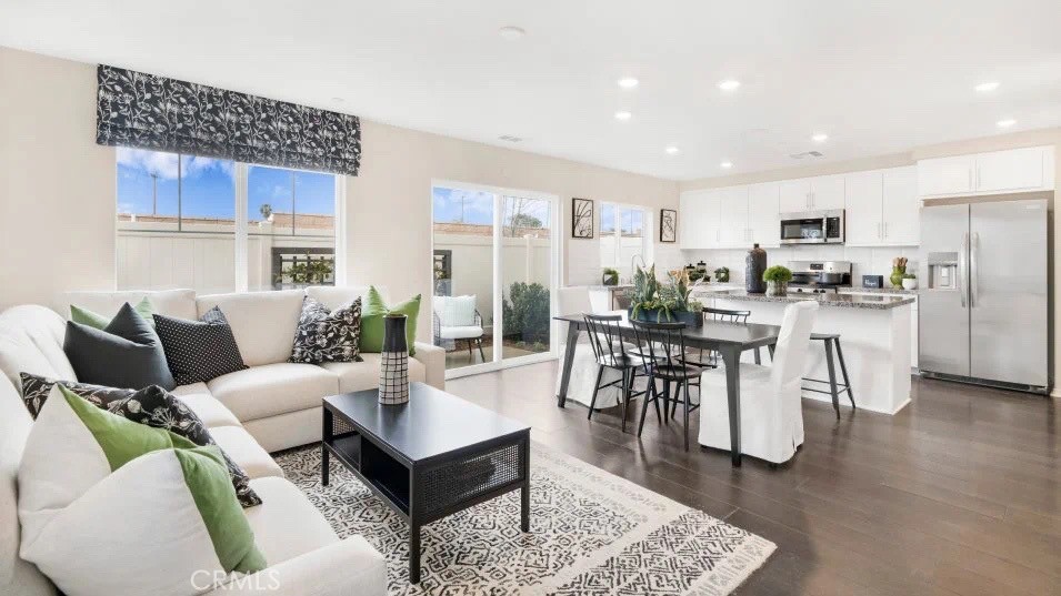 NEW CONSTRUCTION! The first floor of this two-story home shares an open layout between the kitchen, dining area and Great Room, making entertaining easy. Upstairs is a versatile loft that can double as an additional shared living space and home office, depending on the household's needs. There are two secondary bedrooms on the second floor, along with a luxe owner's suite with an en-suite bathroom and a large walk-in closet.
The Gardens is a new collection of upscale townhomes for sale coming soon to the Highgrove Town Center master-planned community in Highgrove, CA. Residents enjoy prime amenities within the community such as social clubhouse, sparkling swimming pool, barbecue areas, tot lot and more. For local outdoor recreation, Box Springs Mountain Reserve Park features trails for hiking, mountain biking and horseback riding. Shopping and dining options at Downtown Riverside and the Mission Inn are just a 10-minute drive, while UCR is even less and nearby K-12 schools are less than three minutes away.
