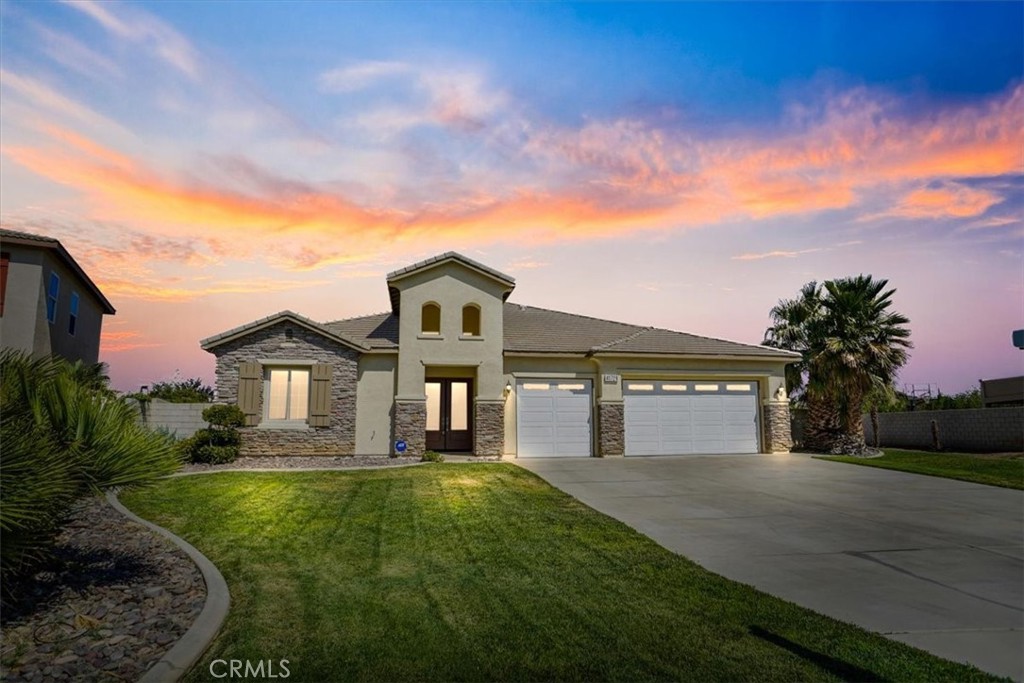 Discover this amazing single-story home in the exclusive gated Portofino Estates Community, boasting no Mello-Roos and a low HOA fee. Recently updated, the property features fresh paint inside and out, brand-new stainless steel appliances, and luxurious vinyl flooring throughout. The spacious floor plan includes four bedrooms, a large kitchen with granite countertops, a butler's pantry, a center island, and ample cabinet space. The wide hallway enhances the custom feel of the home, leading to a living room with a stone veneer fireplace, a formal dining area, and a family room with another stone veneer fireplace and an entertainment alcove, complete with wired surround sound speakers. The expansive 18,078-square-foot lot provides plenty of space in the backyard for a pickleball court, a built-in pool, and more. The large covered patio is perfect for summer BBQs and entertaining. The primary suite is a retreat, featuring a sliding glass door to the backyard, a large oval soaking tub, a separate shower, and a spacious walk-in closet. Additional features of this home include a large laundry room with a sink and ample cabinets, a three-car garage, a tile roof, and new light fixtures. This property is truly a gem with so much more to offer! This property is available for a quick Escrow