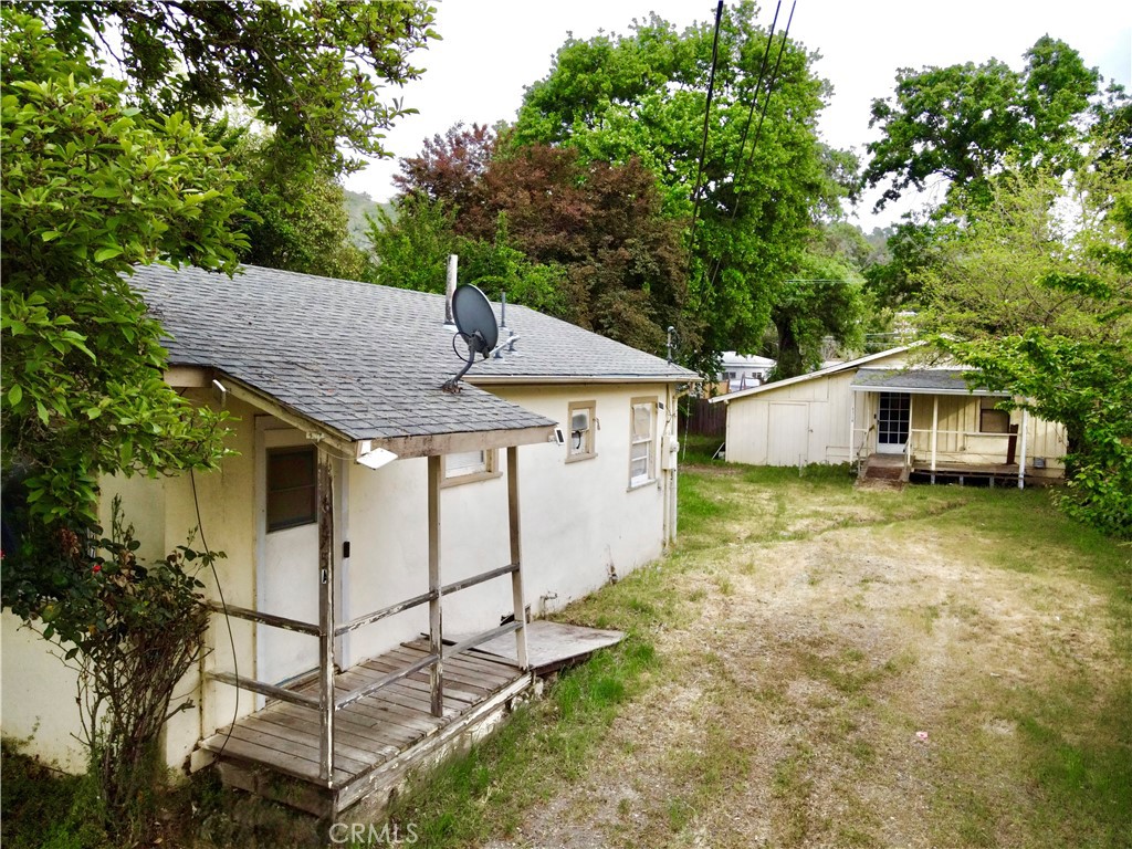 Investment Opportunity: Fixer-Upper featuring two units. Main unit offers 2-bedrooms and 1-bathroom with a large detached shed . Second unit features a cozy studio set back from the main house offering a bit of privacy and separated space. Nestled on a large lot, this pair of fixer-uppers is ripe for renovation and offers ample parking and yard space, perfect for outdoor gatherings.
Recent updates include a new roof for both units, installed in 2021, providing peace of mind as you make this property your own. Located just a few blocks from the lake and public boat launch. This is the perfect property for a contractor looking for a flip or an investor looking to add to their portfolio.
