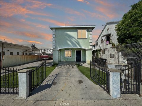 Photo of 6927 Estrella Avenue, Los Angeles, CA 90044 (MLS # MB26064051)
