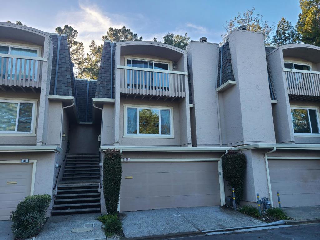 This is a very desirable townhome with 3 bedroom 2.5 baths, family room and eat in kitchen. Living room and dining area with fireplace. Primary bedroom with private deck and views. Family room opening to fenced rear patio. Park like setting. Skylights. Many upgrades: Bathrooms, new carpets, engineered wood floors, freshly painted, granite counters, stainless steel appliances, dual pane windows and custom interior doors. Lots of storage areas. Two car garage. Complex has tennis courts, pool and club house.