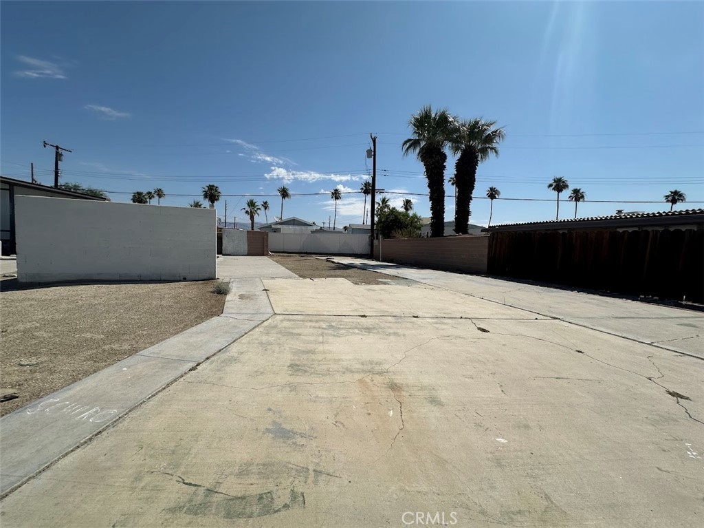 Welcome to Tri Palm Estates & Country Club!. This cement lot is ready for your mobile or manufactured home—bring your vision and start enjoying desert living today! Located in a vibrant 55+ active golf community, residents enjoy access to a clubhouse, swimming pool, golf course, and much more. Conveniently situated near the I-10 freeway, Costco, shopping centers, and Agua Caliente Casino. Motivated seller – seller financing available!