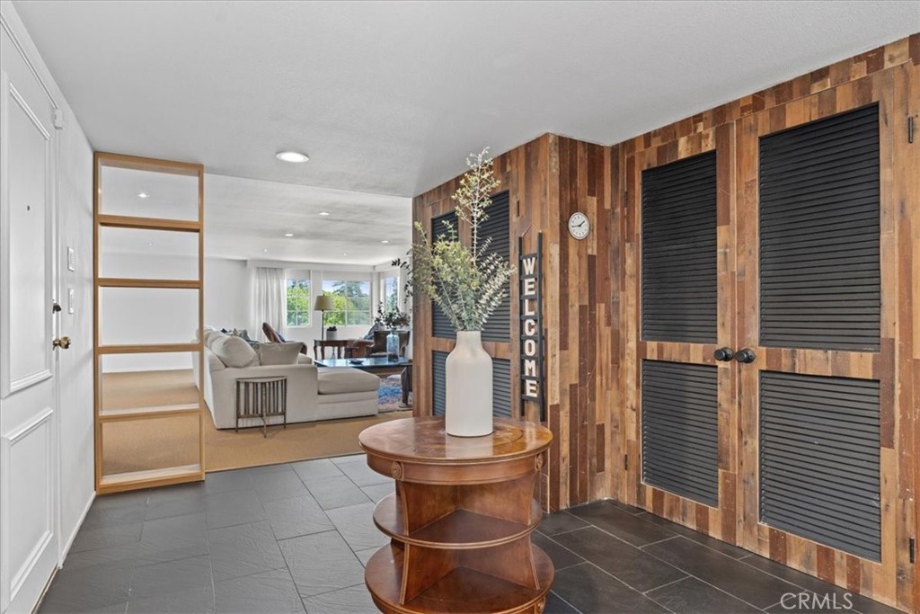 Welcome to elevated living in the heart of Sherman Oaks! This light-filled, top-floor condo offers 3 spacious bedrooms, 3 bathrooms, and comes fully furnished—ready for you to move right in. Designed with comfort and style in mind, the open-concept floor plan boasts expansive living areas and brand-new carpet in multiple rooms. The sleek, fully stocked kitchen is complete with sparkling countertops, a chic island with barstool seating, and a custom built-in wine rack. Retreat to the oversized primary suite featuring a generous walk-in closet and a spa-inspired ensuite bath with dual vanities, a step-in shower, and additional built-in storage. Two additional bedrooms are bathed in natural light, each with ample closet space and access to a beautifully updated hallway bath with a luxe step-in shower. Resort-style amenities include a shimmering pool, a stylish recreational room, and two gated parking spaces. Located just moments from Whole Foods and the vibrant shops and dining on Ventura Boulevard, this turnkey gem perfectly blends modern convenience with laid-back luxury.