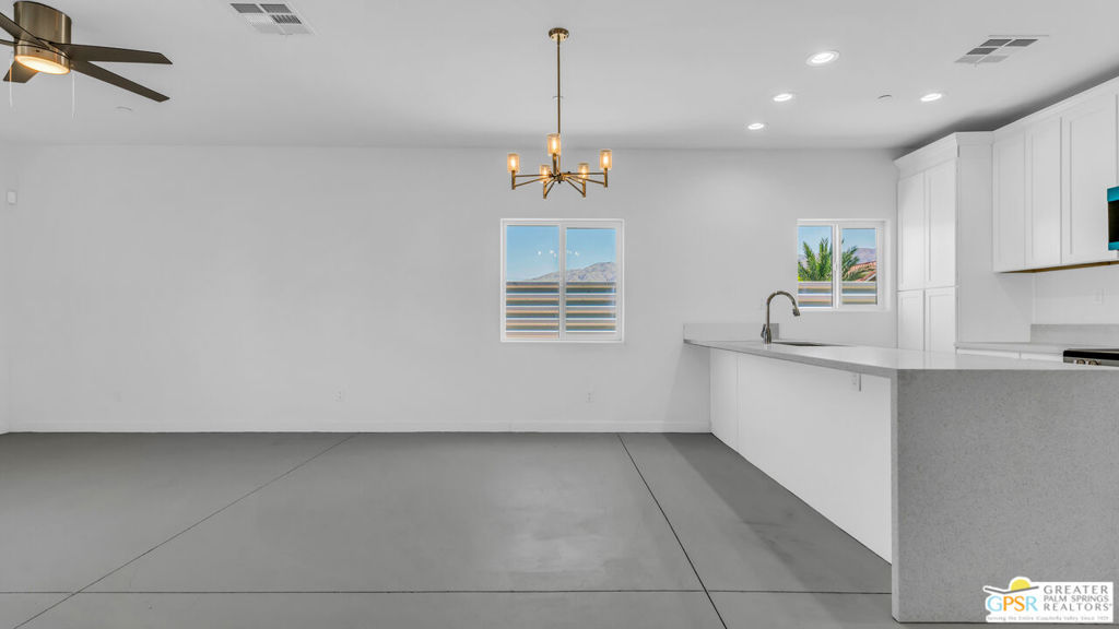Brand-New Dual-Residence Desert Retreat with Owned Solar Discover modern desert living in this newly built 2024 corner-lot home featuring a full guest casita (ADU)perfect for multi-generational living or rental income. With a combined ~2,800 sq ft of stylish living space, this property offers versatility, efficiency, and comfort. The main home boasts an open-concept design with a bright, airy living room, a chef's kitchen with granite counters, breakfast bar, and stainless appliances, plus 3 spacious bedrooms and 2 full baths. The separate casita offers its own kitchen, living area, 2 bedrooms, 1 bath, laundry, and even its own garage ideal for guests, extended family, or an income-producing rental. Additional features include owned solar panels, central HVAC, and parking for multiple vehicles. Located just minutes from Palm Springs, shopping, dining, and renowned hot springs spas, this home blends modern convenience with desert charm. Whether you're seeking a primary home, vacation getaway, or investment property, 13704 Sarita Dr delivers style, space, and flexibility in one move-in-ready package.