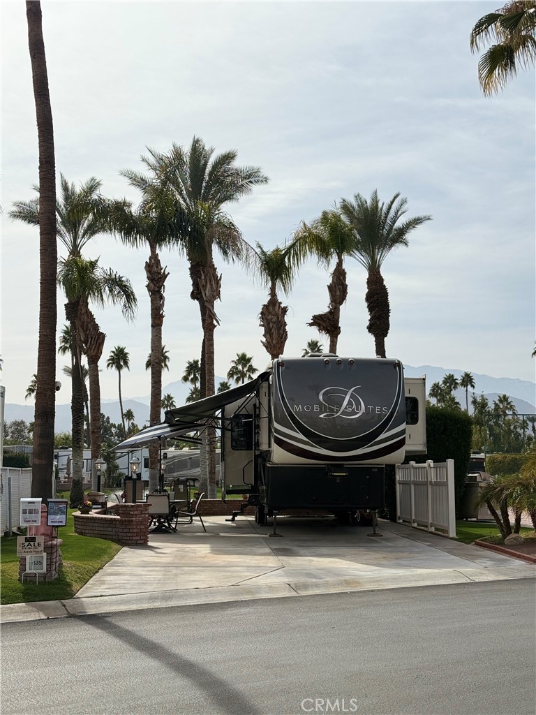 This beautiful Golf Course Lot 1135 sits on the 9th hole of the back nine at the Luxurious Outdoor Resort, Palm Springs RV Resort & Country Club. This beautiful Lot is 1,742 square feet, faces the beautifully landscaped 9th hole, mountain views, and palm trees. Centrally located, across the street from pickleball courts, Owners Lounge, 19th hole Bar, Lupe's Beauty Salon, El Saguaro Club House
