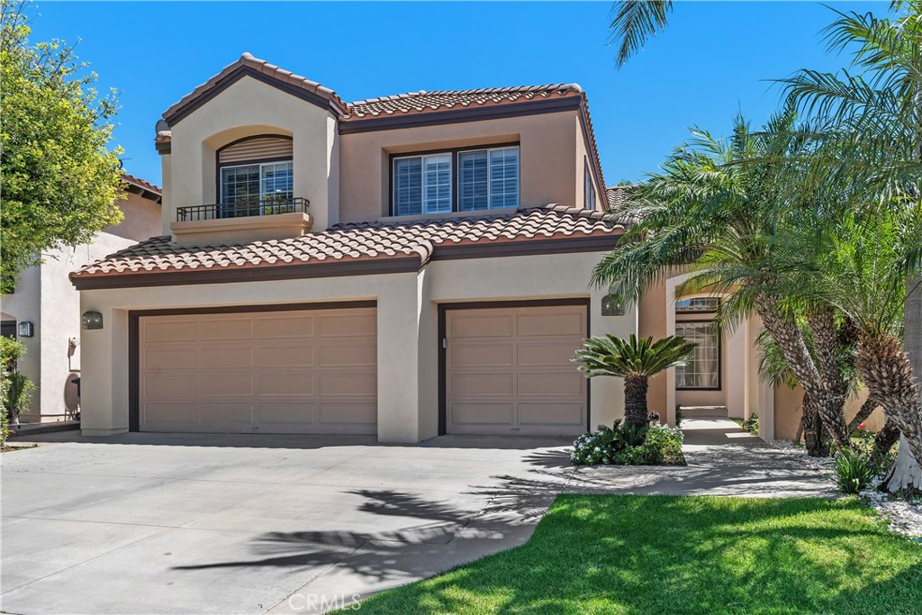 Welcome to this stunning two-story home in the desirable gated community of Tustin Ranch, offering over 2,900 sq. ft. of beautifully upgraded living space. This residence features marble and wood flooring throughout, soaring ceilings, and recessed lighting that enhances its elegant design. The completely remodeled kitchen boasts new cabinets, modern appliances, a large island with bar seating, and a bright breakfast area that flows into the spacious family room with a cozy fireplace. The home offers four bedrooms plus a bonus room and three remodeled bathrooms—one bedroom and bath conveniently located downstairs. Each bathroom is upgraded with modern fixtures including handheld and rain showers. Additional highlights include a formal living room, formal dining room, recessed lighting throught and ceiling fans in all room. A three-car garage with epoxy floors. The backyard is generously sized yet low-maintenance, perfect for relaxing or entertaining. Centrally located near major freeways, this home combines luxury, comfort, and convenience in a secure gated setting.