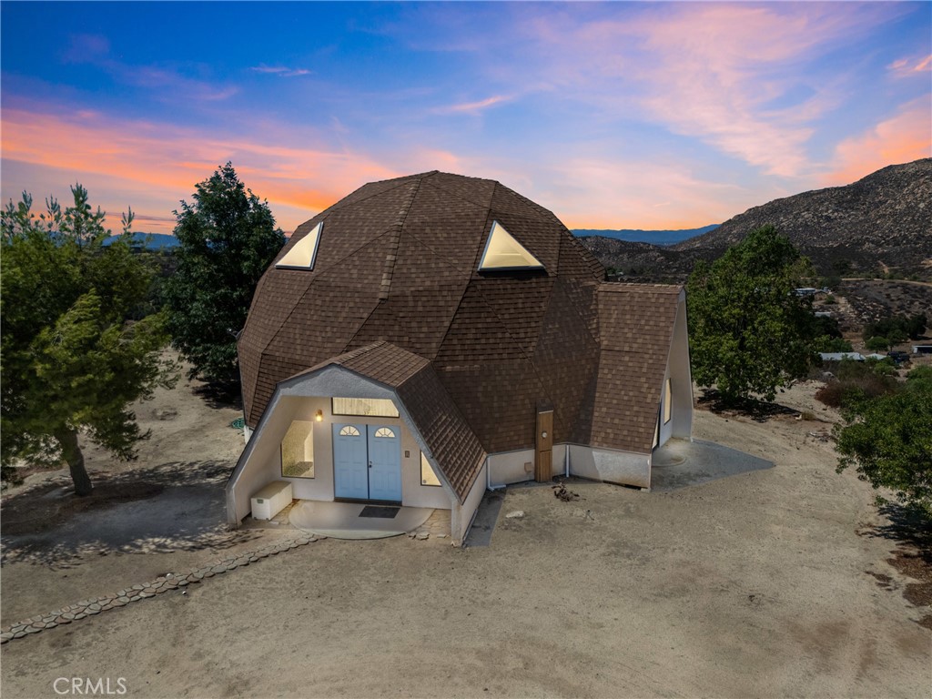 A Rare Geodesic Dome Retreat in Temecula Wine Country – 9 Acres of Privacy & Views
Experience the best of wine country living in this extraordinary 3 bedroom, 2 bathroom geodesic dome home, set on 9 private acres in the rolling hills of Temecula. Designed with innovation and strength in mind, geodesic dome architecture is celebrated for its energy efficiency, durability, and ability to flex with the earth—standing strong against snow, wind, and even earthquakes. Inside, the home feels open, light, and inviting, with soaring spaces that highlight the unique curves of the dome. Practical upgrades like a whole-house vacuum system add modern convenience to this one-of-a-kind home.
Step outside and you’ll find even more to love: a separate dome garage structure offers abundant storage and potential for workshop or hobby space. From every angle of the property, enjoy sweeping mountain views, complete privacy, and the peaceful lifestyle that only Temecula wine country can offer. With 9 acres to call your own, the possibilities are endless—plant vines, create gardens, add structures, or simply enjoy the wide-open space as your private retreat. And when you’re ready to explore, you’re just minutes from Temecula’s award-winning wineries, fine dining, and charming Old Town.Book your showing today!!