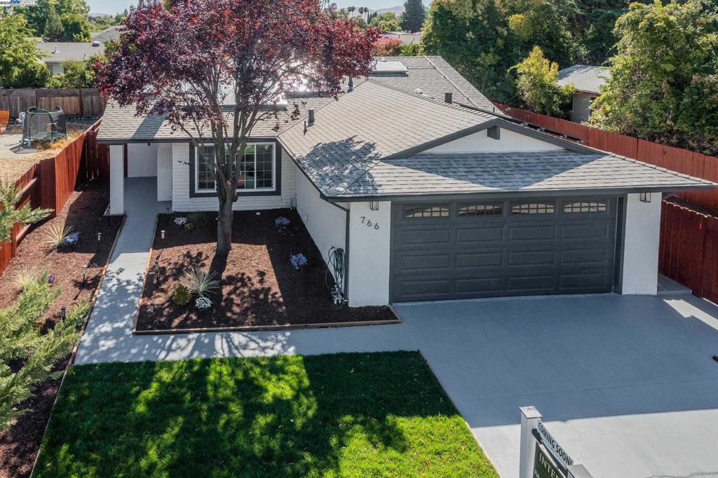 Welcome to this beautifully updated single-story home in the heart of Livermore-with Solar Panels.Open House Sat & Sun 1-4pm. Wow... Step into this beautifully updated home, where modern elegance meets everyday comfort! The kitchen is a chef's dream, featuring slab counters, ample cabinetry, and stainless steel appliances, including a coveted gas stove. The open floor plan is bathed in natural light, complemented by LVP floors throughout, making maintenance a breeze. Whether you're hosting a gathering or enjoying a quiet evening, this home is perfect for both indoor and outdoor entertaining. The backyard is a private oasis with a large concrete patio, low-maintenance living, and side yard access for added convenience. This 4-bedroom, 2-bath gem is nestled in the desirable neighborhoodof Wagner Farms- The primary bedroom offers a serene retreat with an attached bath, while the bright and airy family room opens to a spacious backyard, ideal for outdoor barbecues or cozy nights around the fire pit. With a newer roof this home is move-in ready. Located just minutes from downtown Livermore, shopping, and easy freeway access, this stunning home is not to be missed!