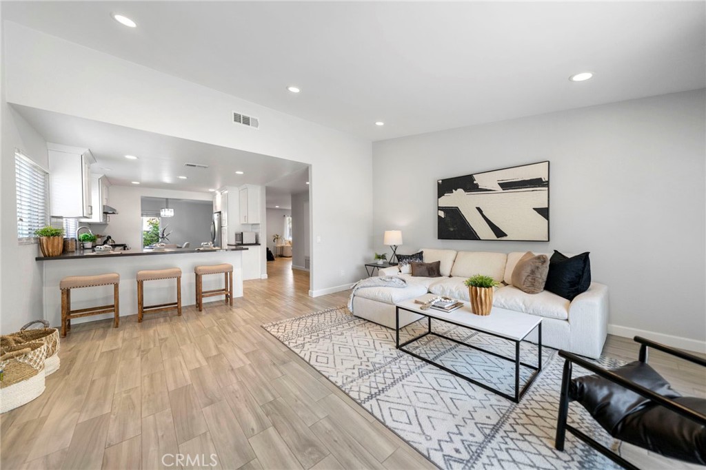 Welcome to this beautifully remodeled, single-story home nestled at the end of a peaceful cul-de-sac in West Covina. Boasting a spacious open floorplan, this home features a kitchen which opens seamlessly into the family room with its cozy fireplace and easy access to the inviting backyard - perfect for modern living and entertaining. Enjoy the additional space of a formal dining area and a separate formal living room, offering flexibility for gatherings or quiet evenings at home. The private primary suite includes an attached bathroom with dual sinks and walk-in shower for added comfort and convenience. Recently updated, the home showcases newer flooring, appliances, and tastefully remodeled kitchen and bathrooms. Dual-pane vinyl windows and a sliding door bring in natural light while enhancing energy efficiency. The backyard offers serenity with no rear neighbors, creating a calm outdoor setting. Located in a quiet neighborhood with no HOA, 1708 Varilla provides tranquility while still having easy access to multiple freeways and commercial areas. Don't miss this opportunity to own a stylish, move-in ready home in one of West Covina's best pockets!