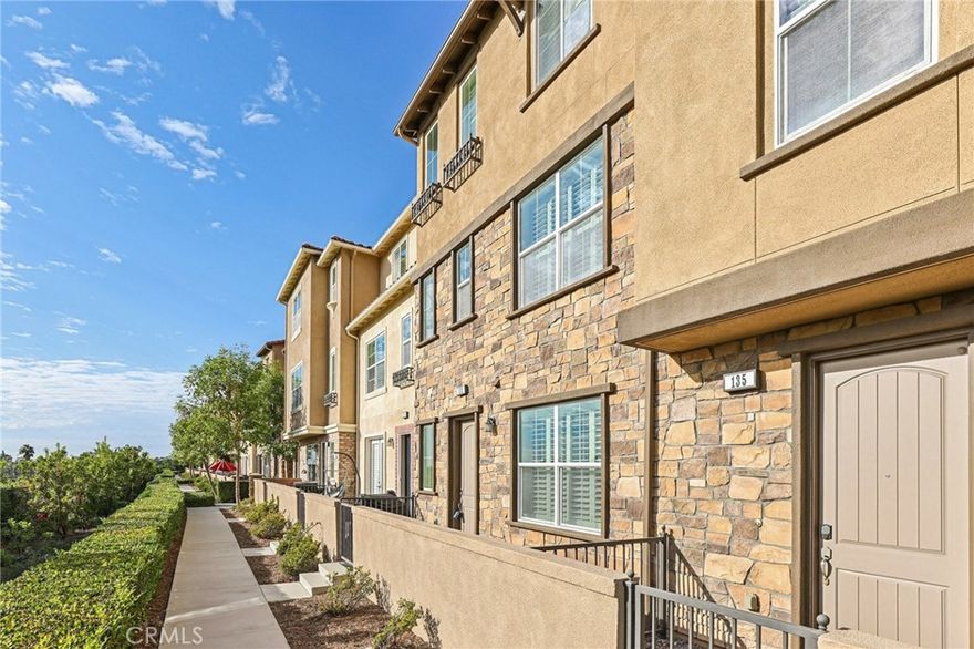 Welcome to 133 Aliso Ridge Loop, a beautifully appointed home in the sought-after Ridge community of Mission Viejo. The entry level offers a private front patio with sweeping sunset, city light, and mountain views, plus a bedroom with an ensuite bath and direct access to the two-car garage. The main level features an open-concept design with laminate wood floors, plantation shutters, and recessed lighting. The living and dining areas flow seamlessly into the chef’s kitchen, showcasing granite countertops, white cabinetry, a spacious center island, and stainless steel appliances, with a door leading to a private balcony. A powder room and full-size laundry room add convenience. Upstairs, the primary suite boasts dual vanities, a soaking tub, walk-in shower, and generous walk-in closet, while a secondary bedroom enjoys its own ensuite bath. The community offers a pool, spa, and playground, all within close proximity to shopping, dining, schools, and parks.